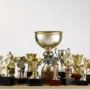 close-up-trophies-table-against-white-background_4